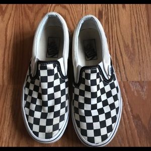 Women’s black and white checkered Vans